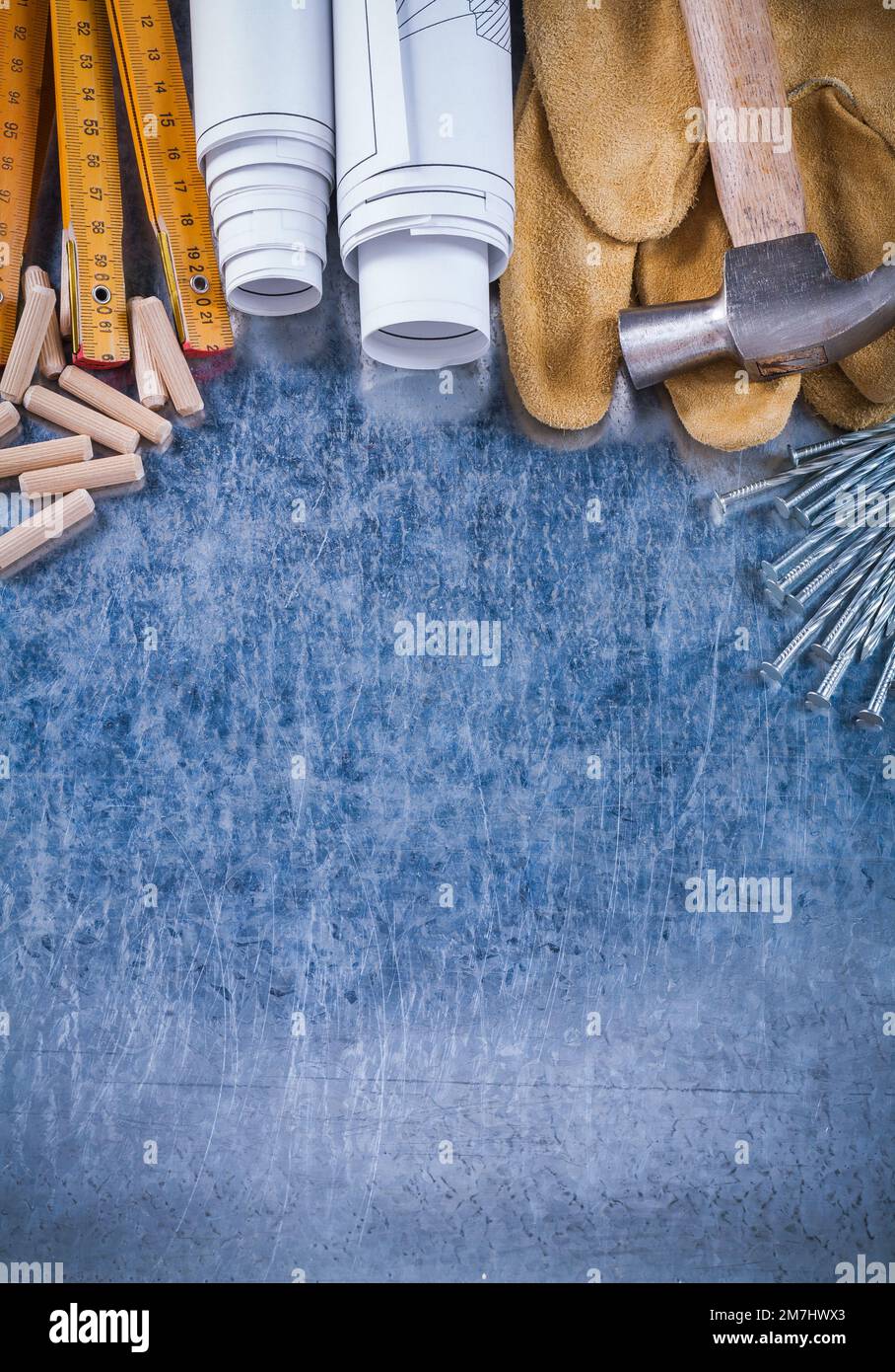 Blueprint rolls claw hammer safety gloves wooden meter steel nails and