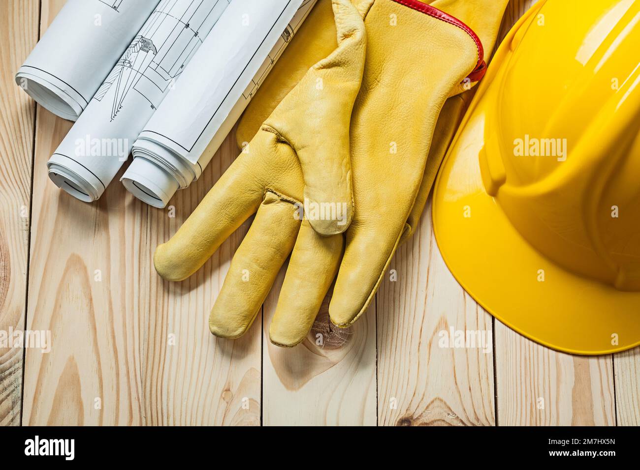 Blueprints yellow hard hat tool hi-res stock photography and images - Alamy