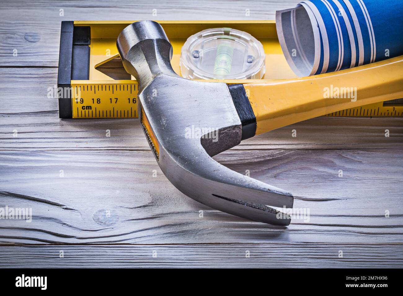 Claw hammer blue rolled engineering drawings construction level on ...