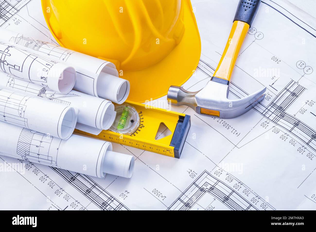 claw hammer construction level helmet rolled blueprints horizontal