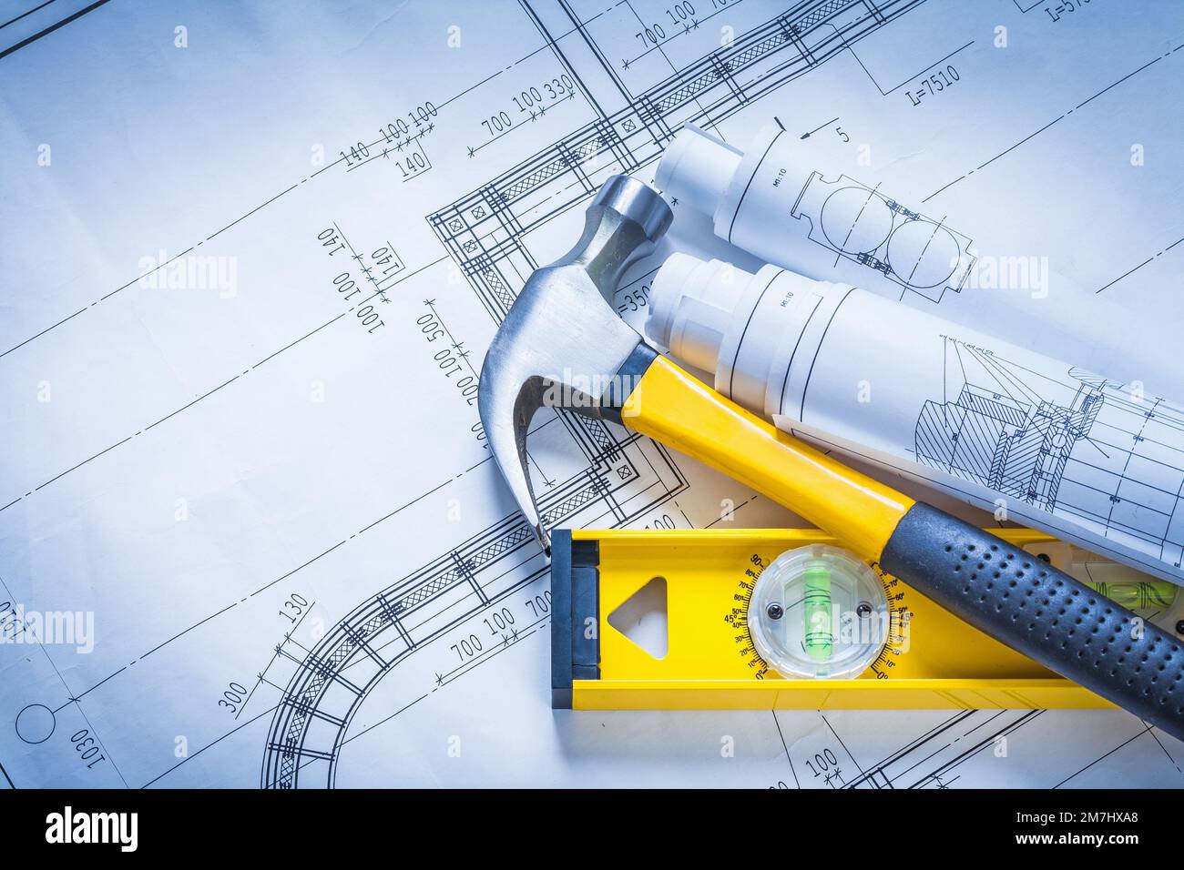 Claw hammer rolls of blueprints construction level building and ...