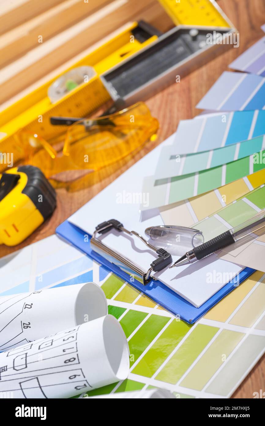 color palette and blueprints on table with other tools Stock Photo