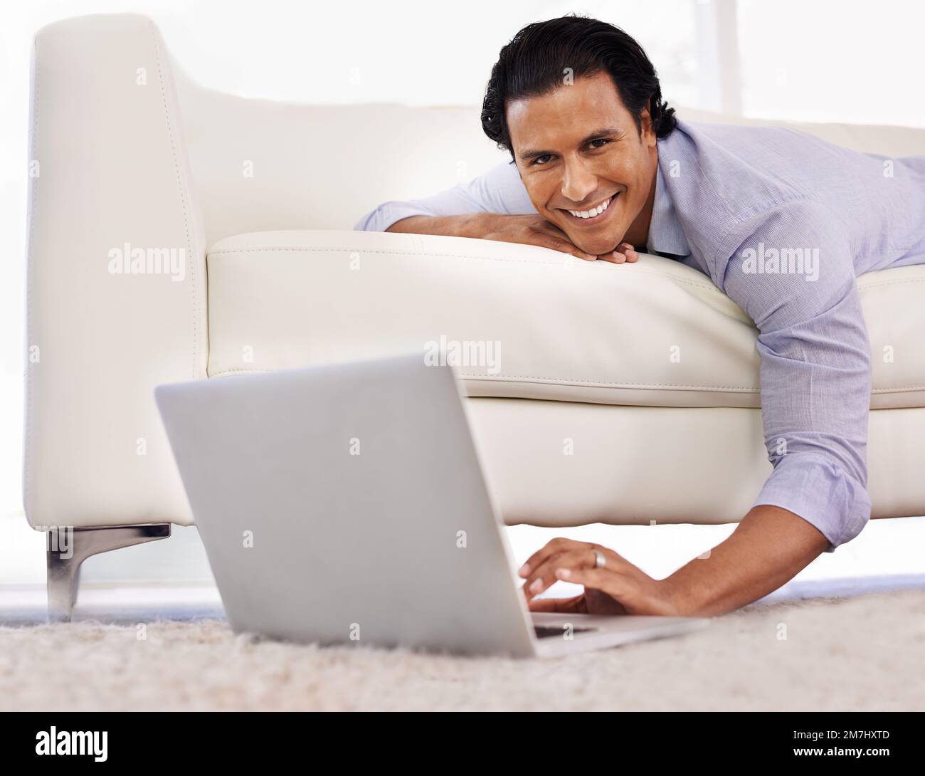 Indian man using laptop at home hi-res stock photography and images - Alamy