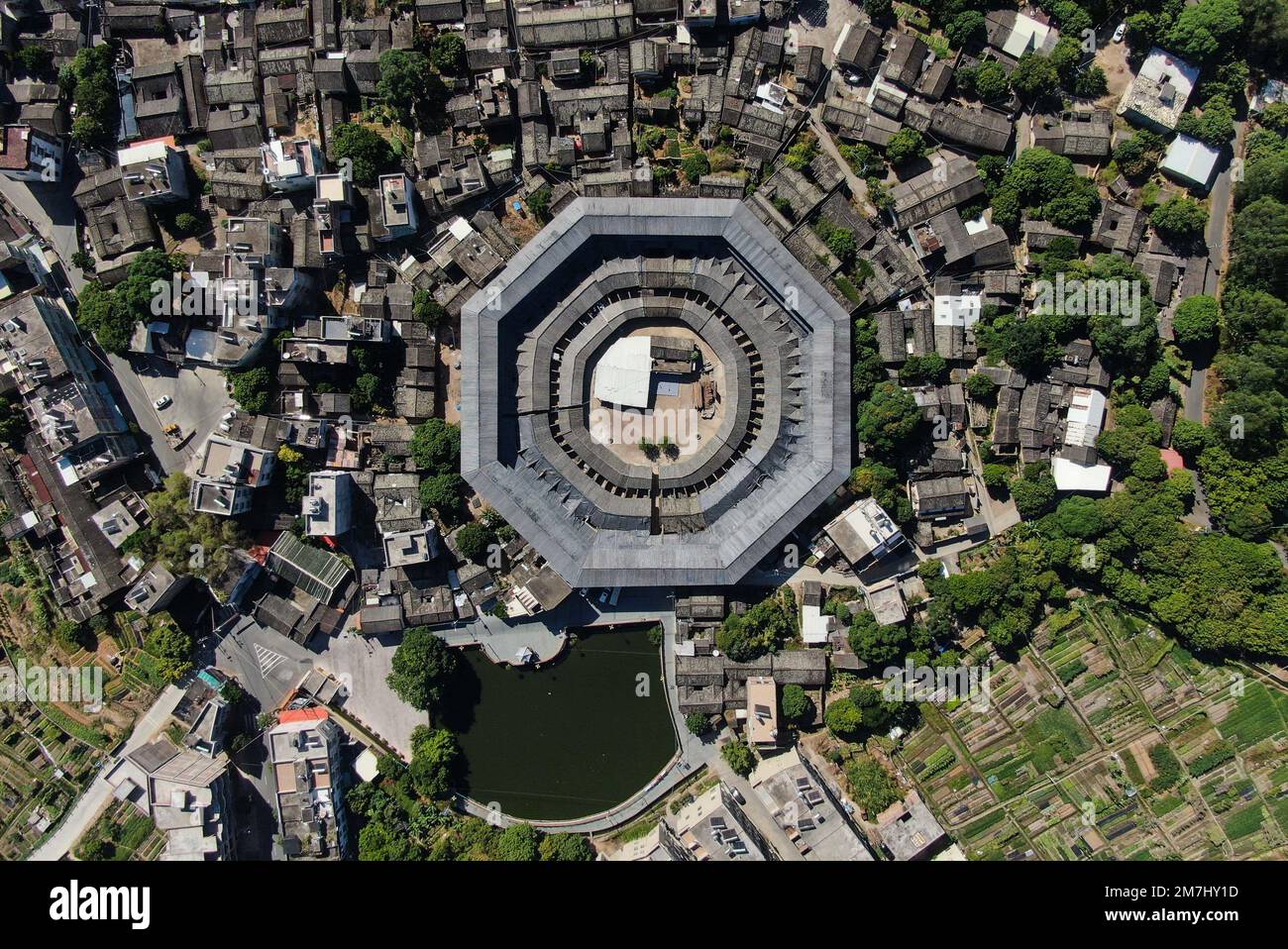 Beijing, China. 21st Oct, 2022. This aerial photo taken on Oct. 21, 2022 shows Daoyun Lou, an octagonal Tulou earthen building compound in Raoping County of Chaozhou, south China's Guangdong Province. Daoyun Lou, which covers a floor area of 10,000 square meters, is China's largest octagonal Tulou earthen building discovered so far. In 2006, it became a major historical and cultural site protected at the national level. Credit: Deng Hua/Xinhua/Alamy Live News Stock Photo