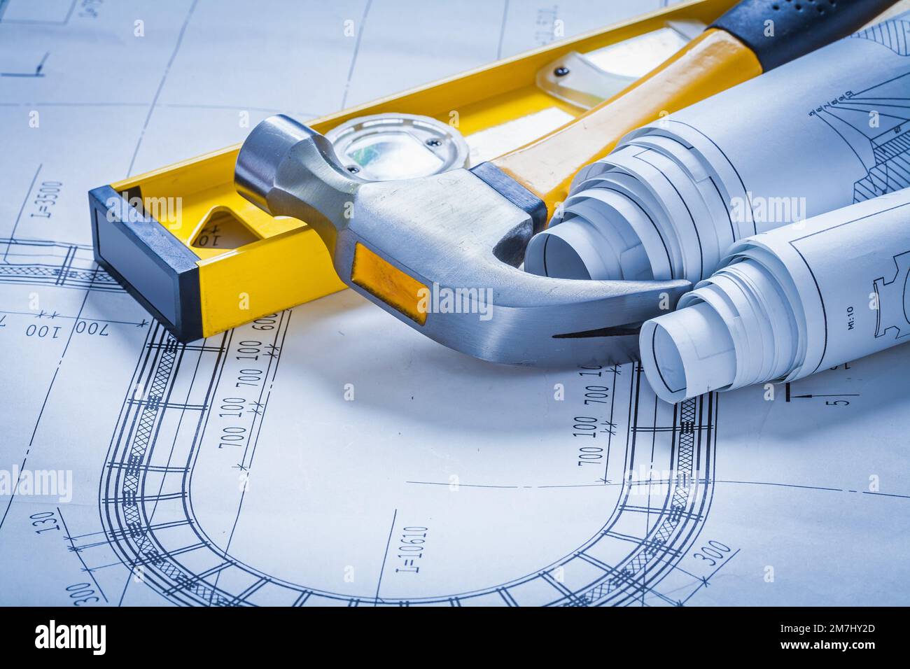 Construction level claw hammer and set of blueprints maintenance ...