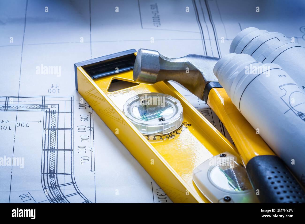 Construction level some building sketches and claw hammer maintenance