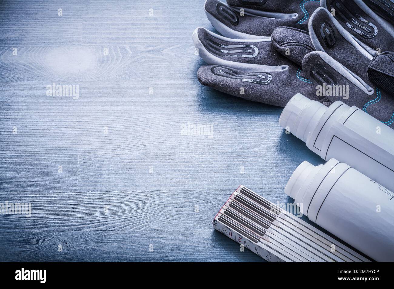 copyspace image working glove rolled blueprints and wooden meter Stock ...