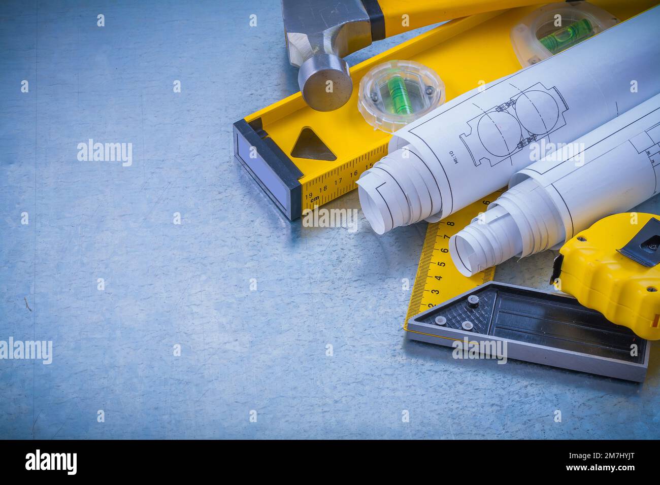 Hammer measuring tape blueprints construction level square ruler on ...