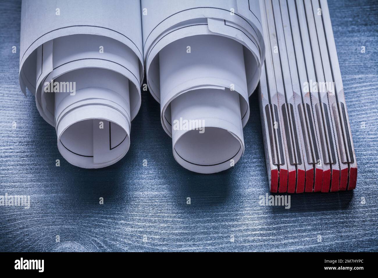 horizontal view two rolled up white blueprints and wooden meter Stock ...