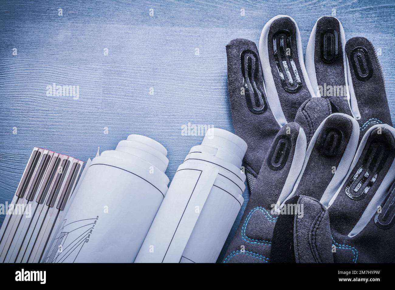 horizontal view working glove rolled blueprints and wooden meter Stock ...