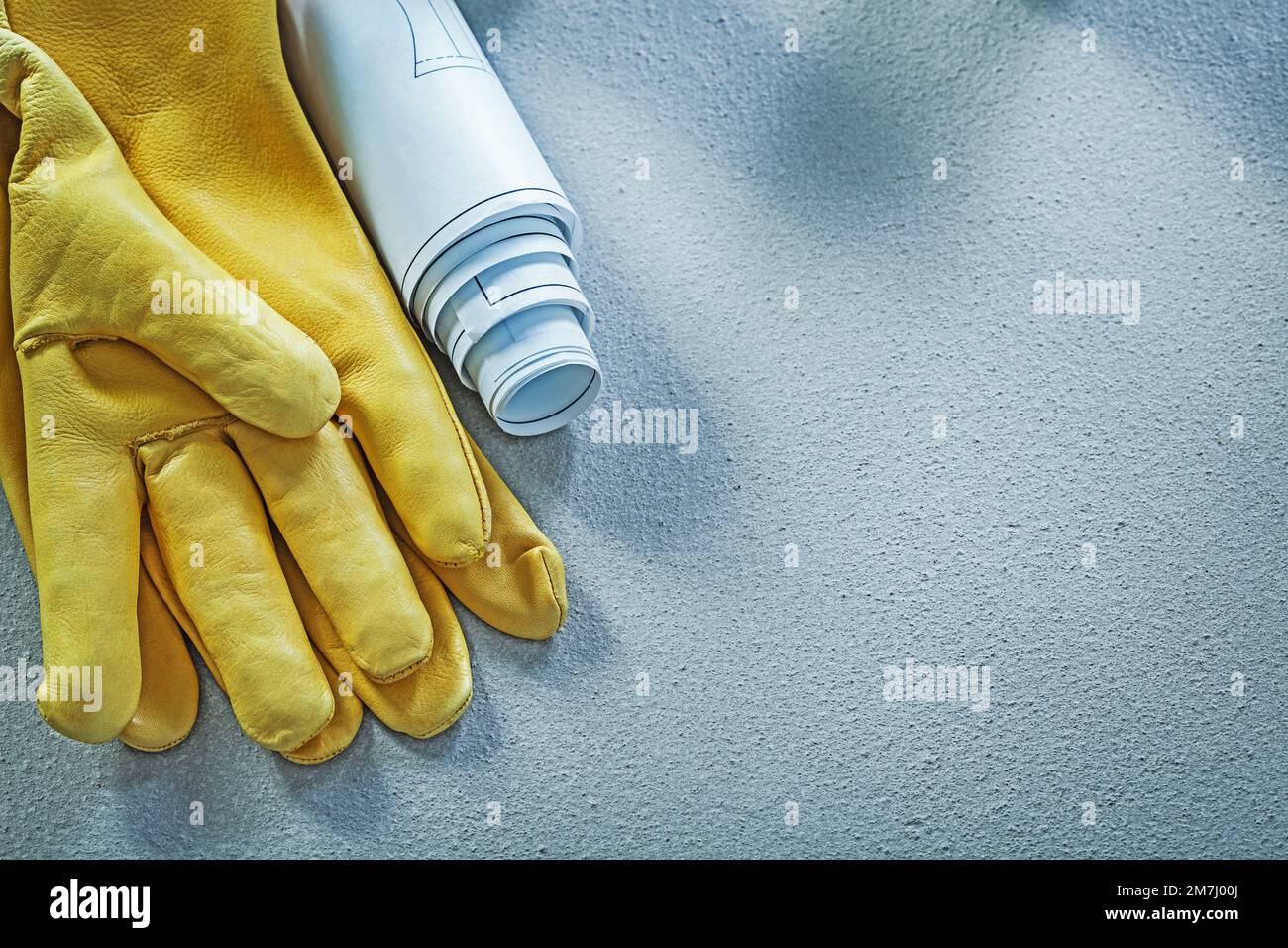 Leather safety gloves engineering drawings on concrete background ...