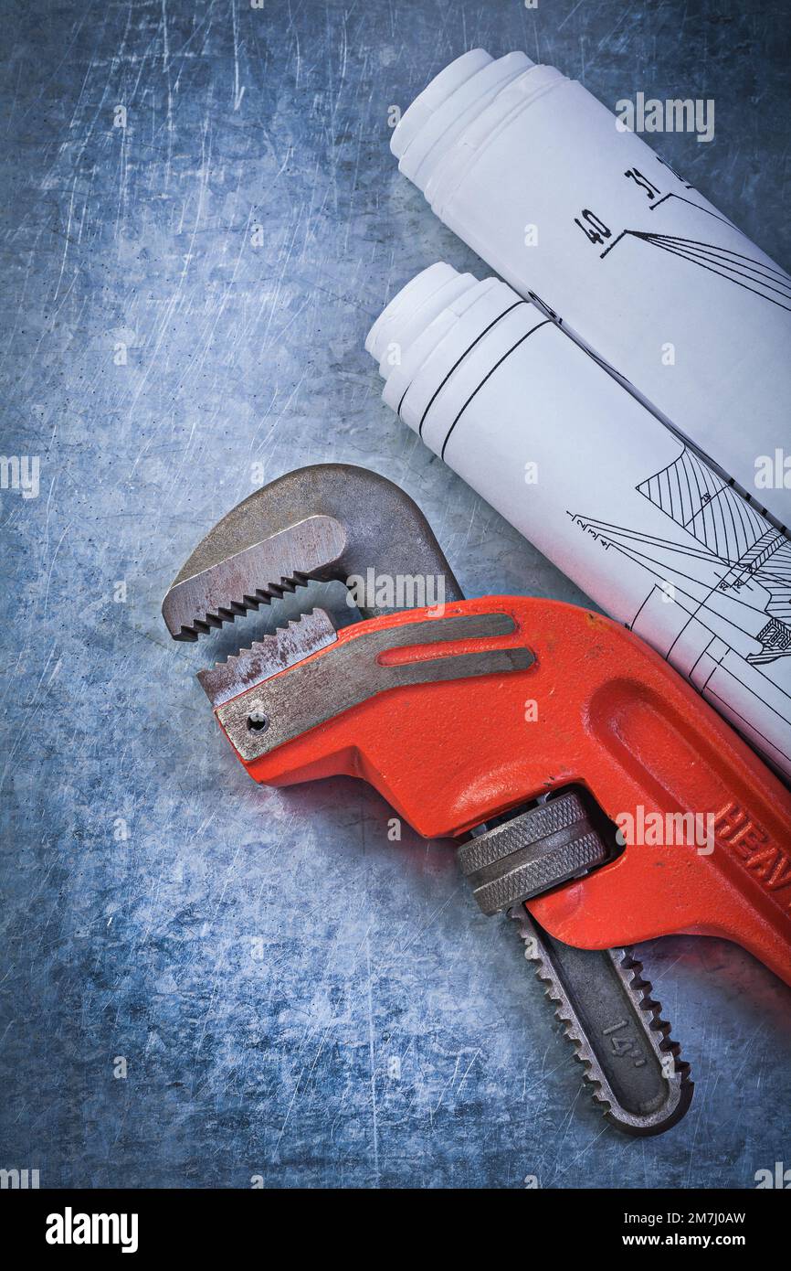 Pipe adjustable wrench construction plans on metallic background