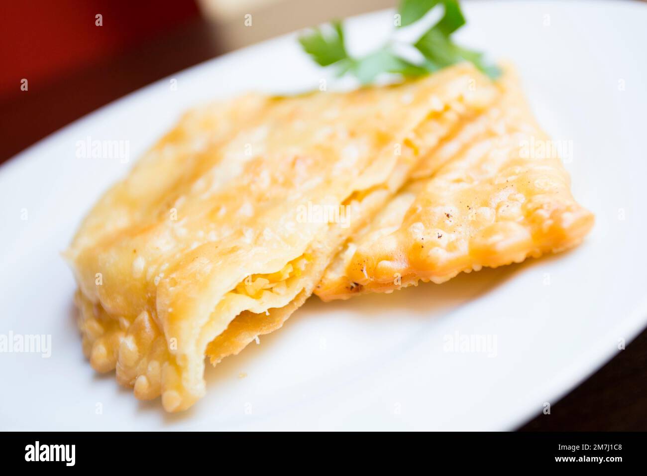 Festive Russian Kurnik sliced pie stuffed with chicken, potatoes and onions  close up on a slate board on the table. vertical top view above Stock Photo  - Alamy