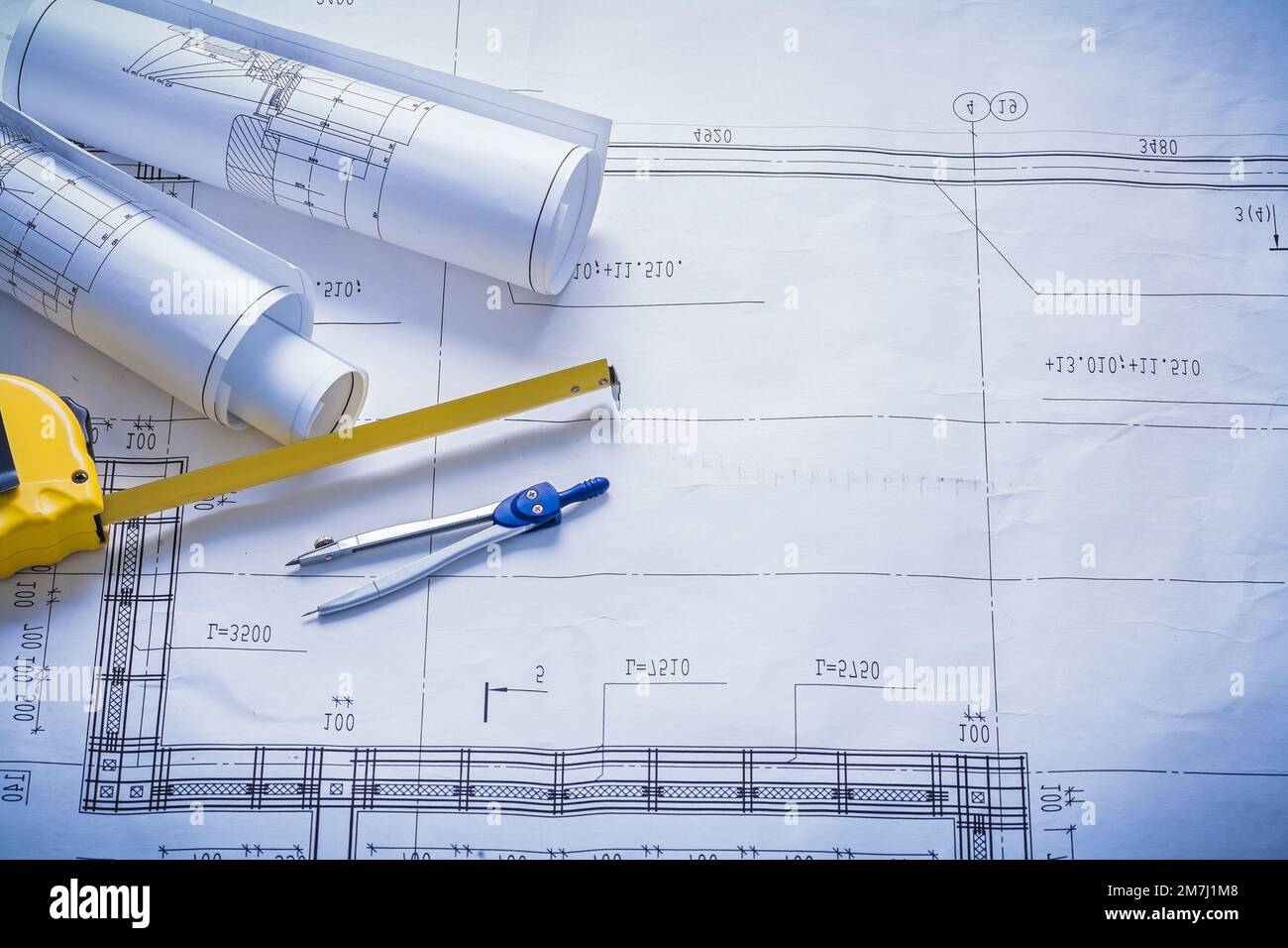 Compass One Blueprint Map two rolled blueprints tapeline compass with copyspace construction ...