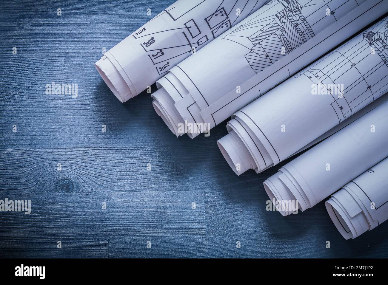 vertical view five rolls of blueprints very close up Stock Photo - Alamy