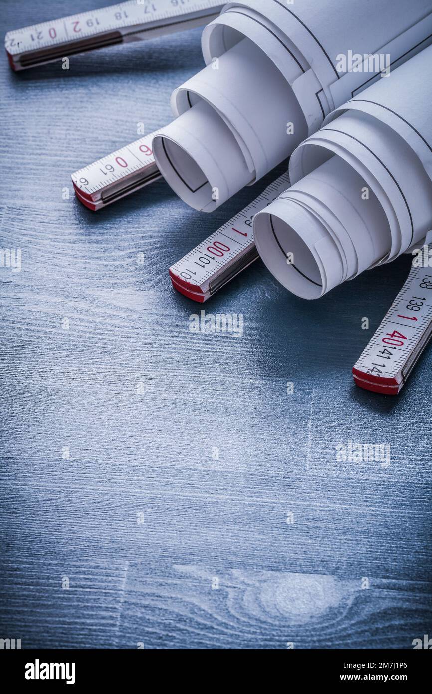 vertical view two rolls of blueprints on white wooden meter Stock Photo ...