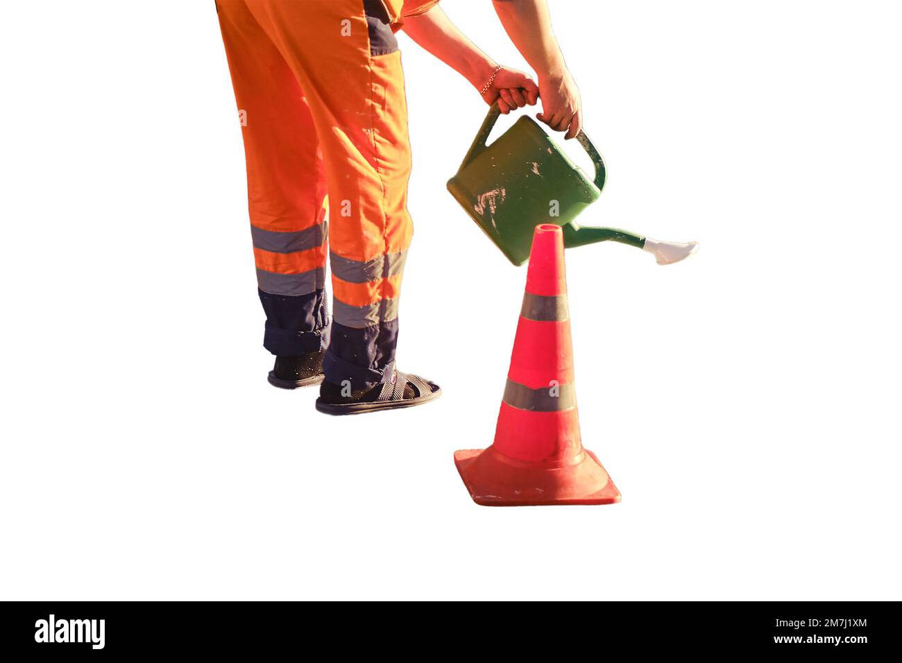 A road worker draws a stop line on the asphalt with white paint using a