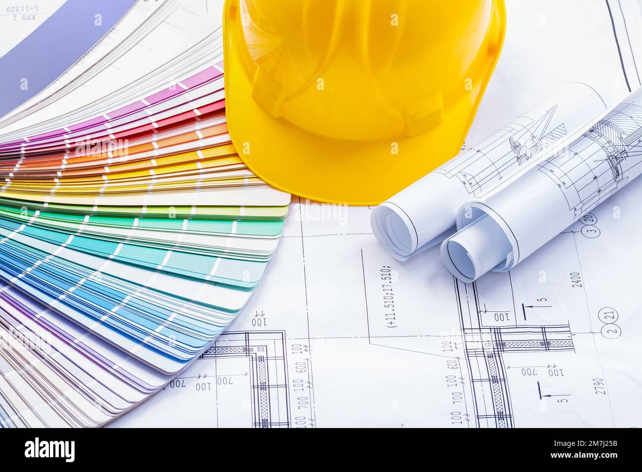 yellow helmet color palette rolled blueprints Stock Photo - Alamy