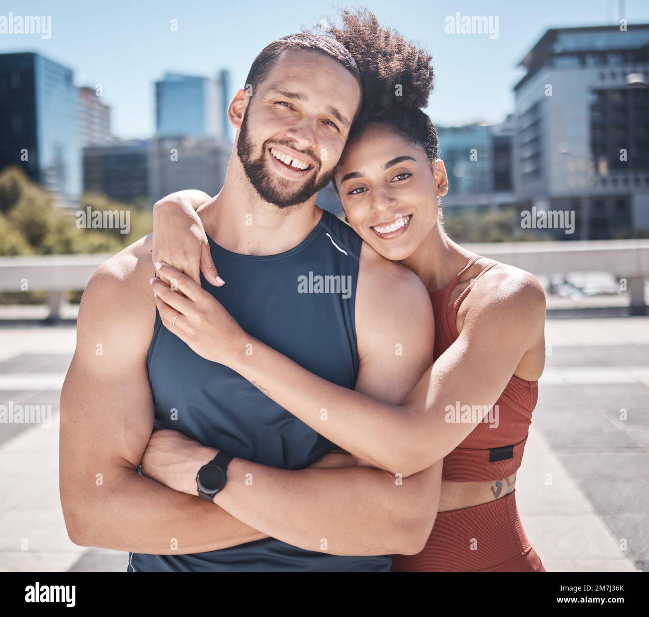 Fitness, portrait and couple of friends in city workout, training or exercise in support, love and motivation with hug for teamwork. Urban, sports and Stock Photo