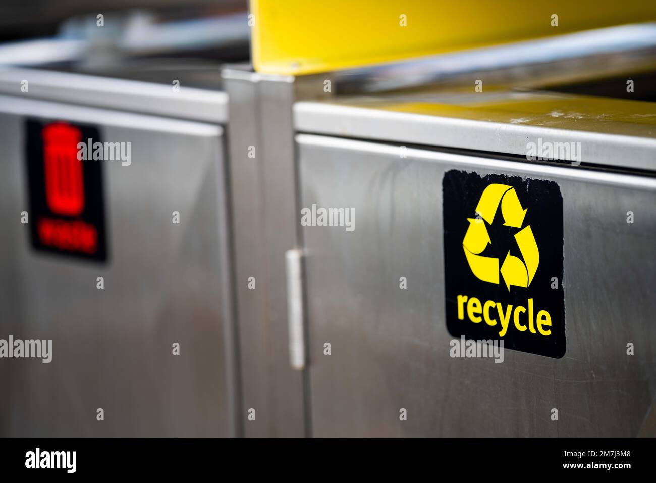 red waste bin and yellow recycling bin in hobart tasmania. metal bin