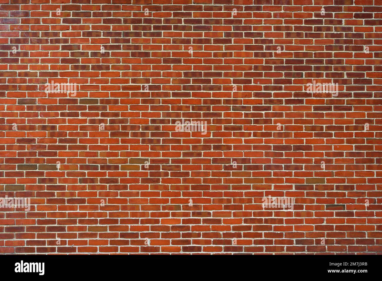 Red brown block brick wall Beautifully arranged texture background. Stock Photo