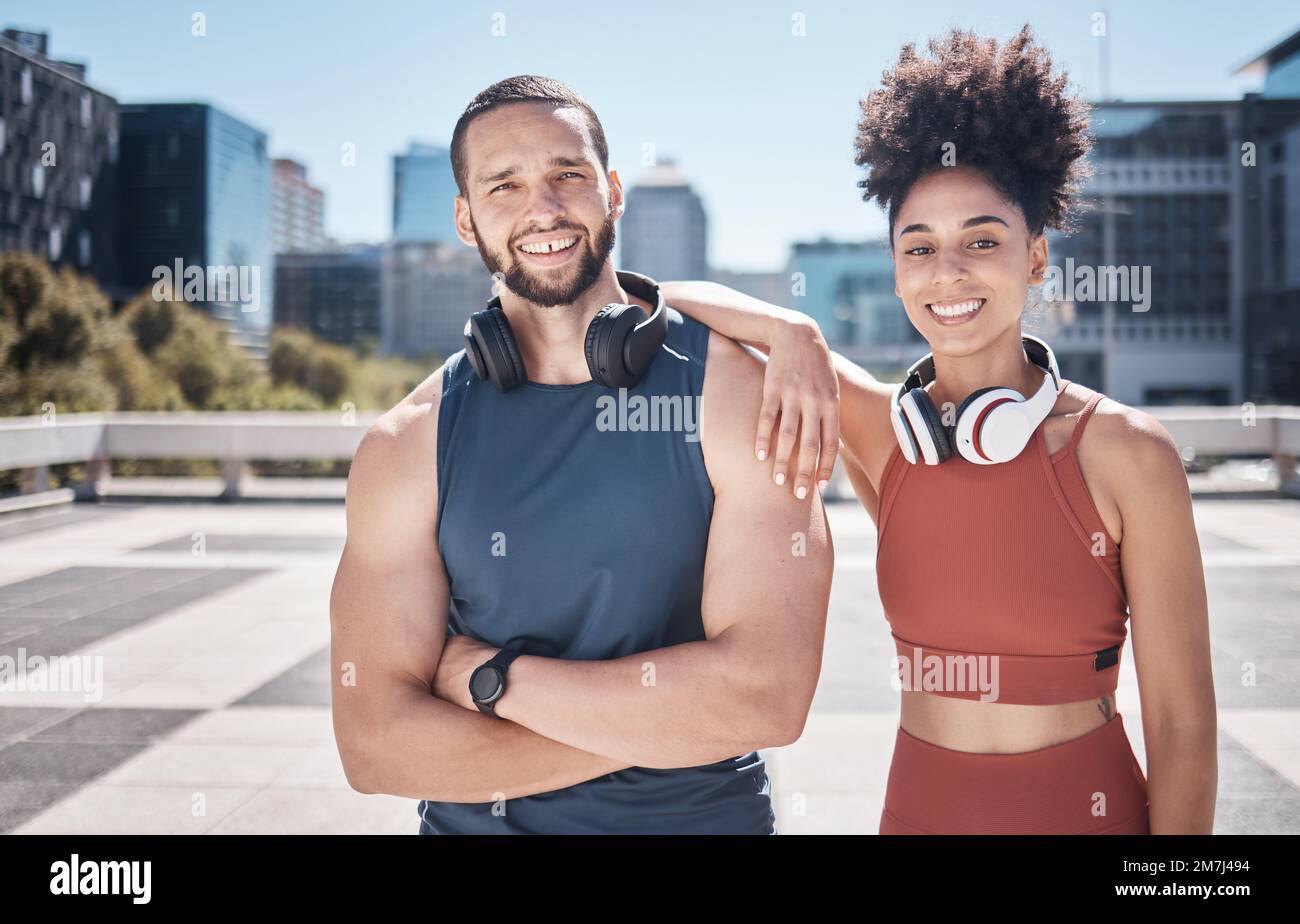 Sports fitness, portrait and couple in city ready for workout, training or exercise. Face, diversity and happy man and woman standing on street Stock Photo