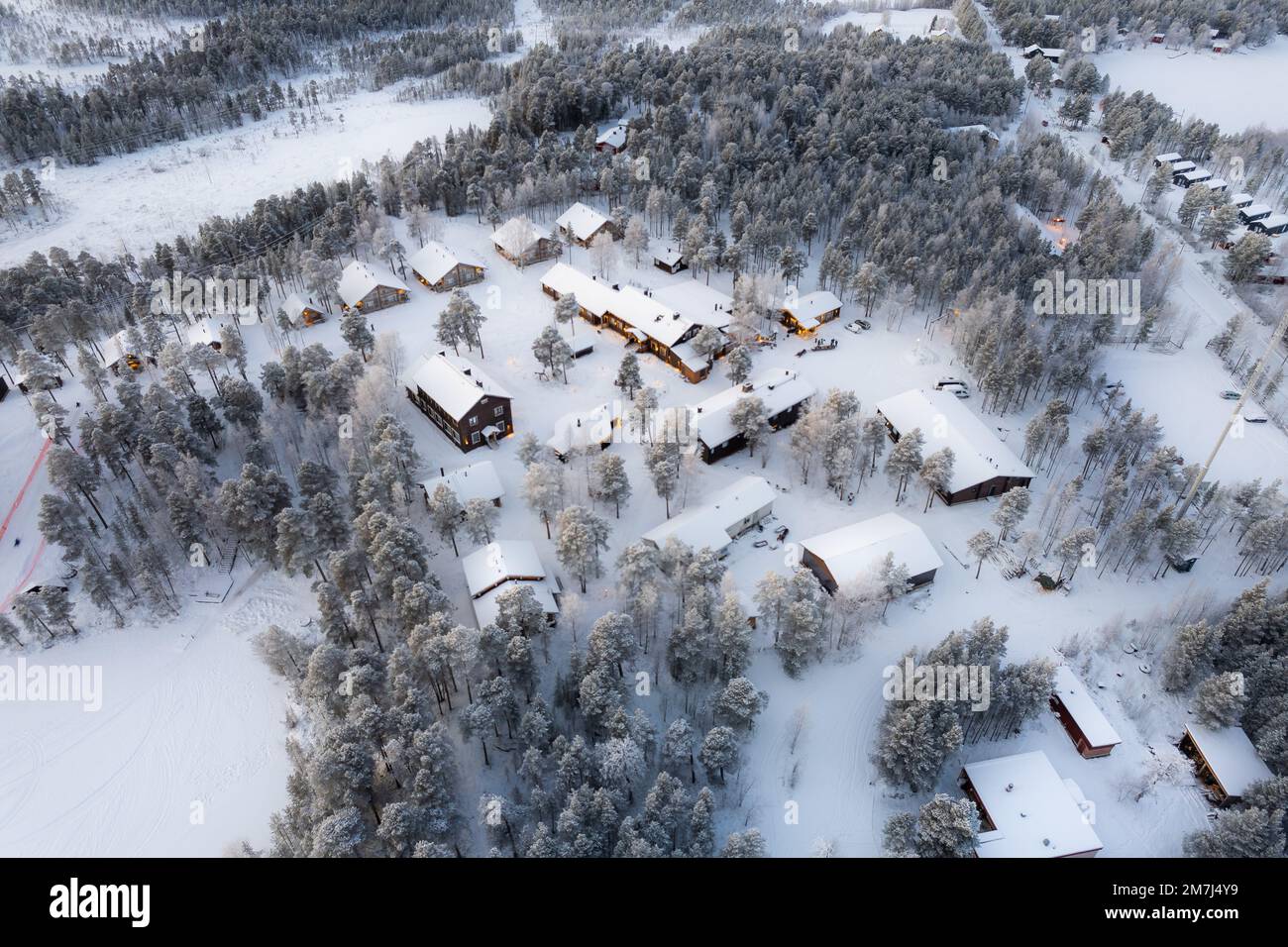 A beautiful view of snowy village with small houses and trees Stock ...
