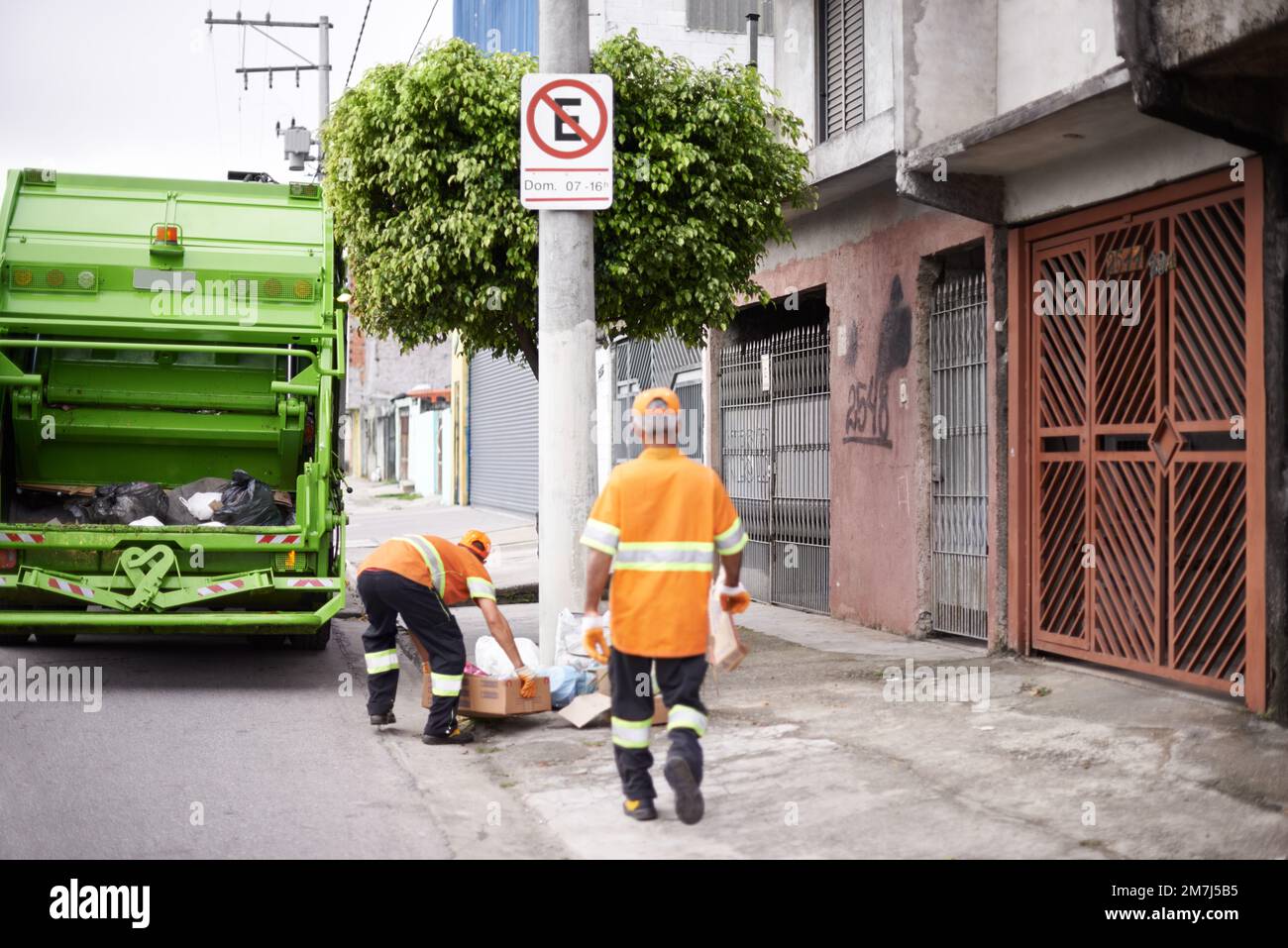 Garbage collection day. a garbage collection team at work Stock Photo