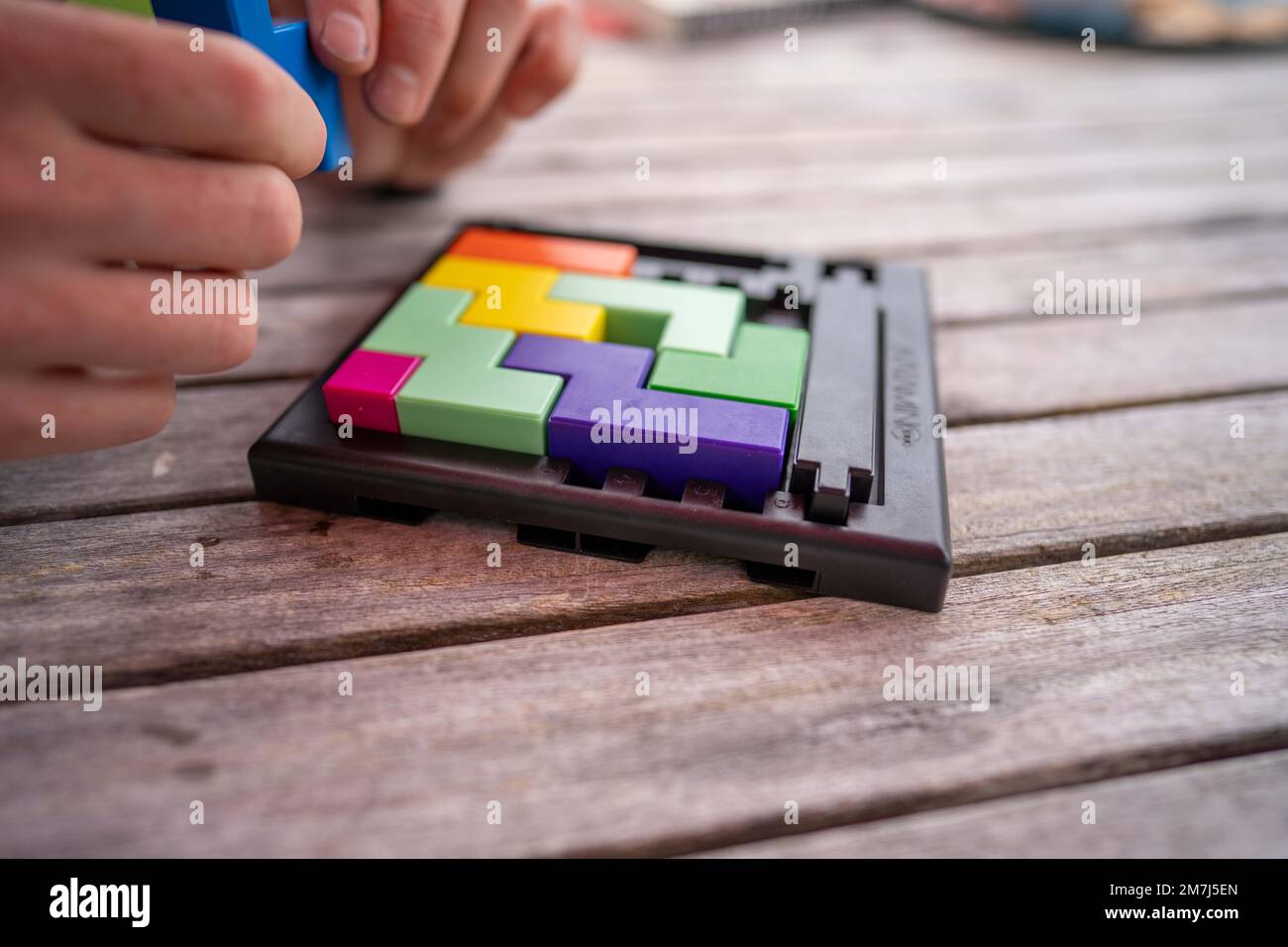 playing a puzzle game in the holidays with the family. block puzzle