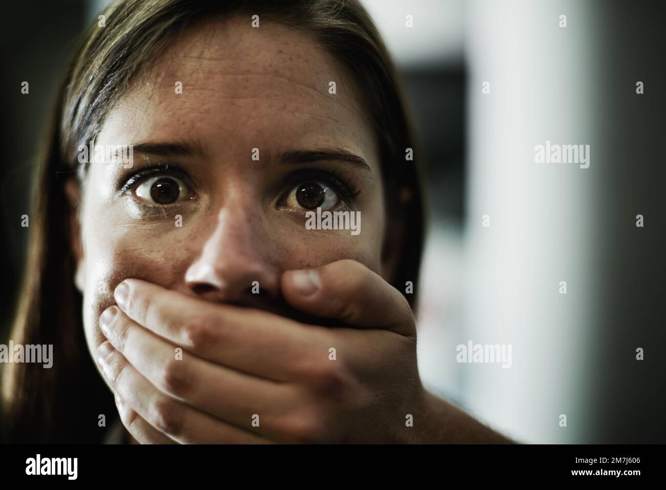 Silent pleas for help. A terrified young woman held captive by a man