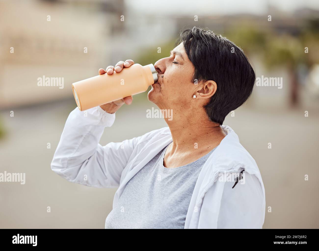 Fitness, runner or old woman drinking water with sports goals resting