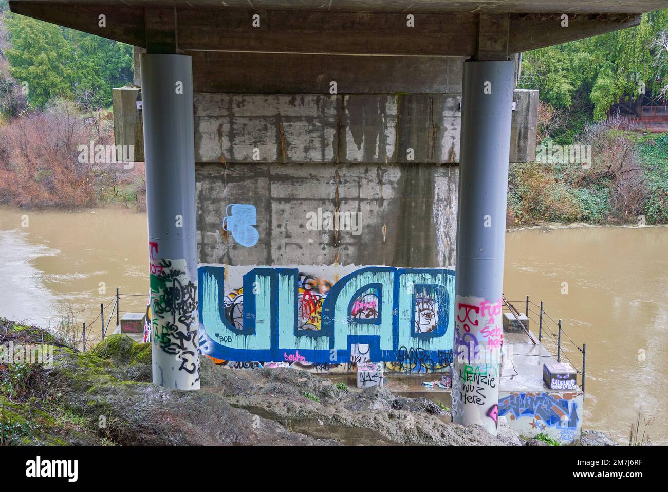 The name VLAD and other graffiti on the underside of a bridge over the Russian River in Forestville, California. Stock Photo