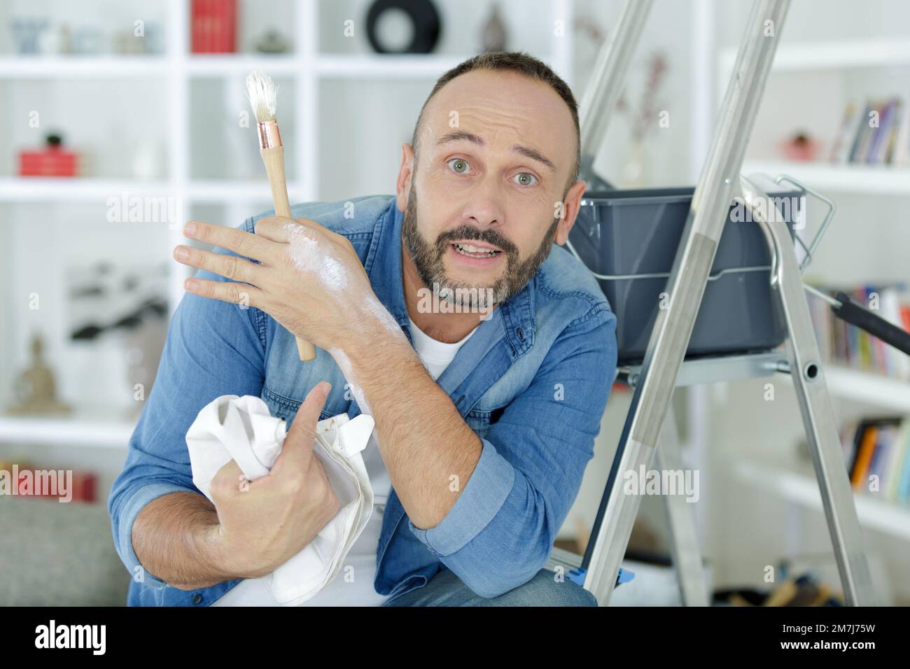 man painting house in diy concept Stock Photo Alamy