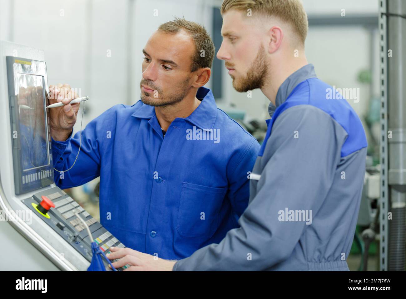 the colleagues working in garage Stock Photo