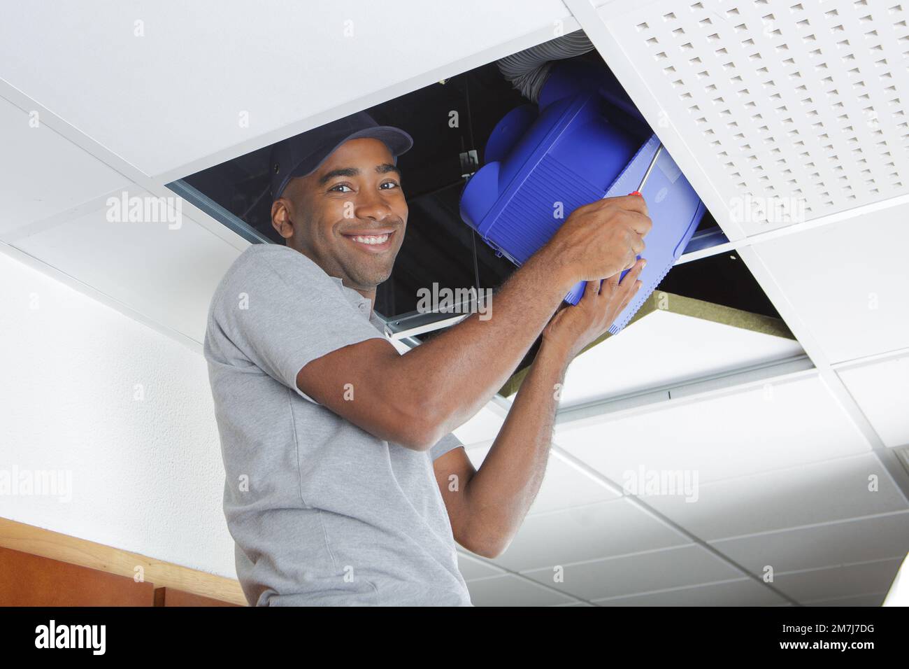 portrait of contractor fitting ventilation system Stock Photo Alamy