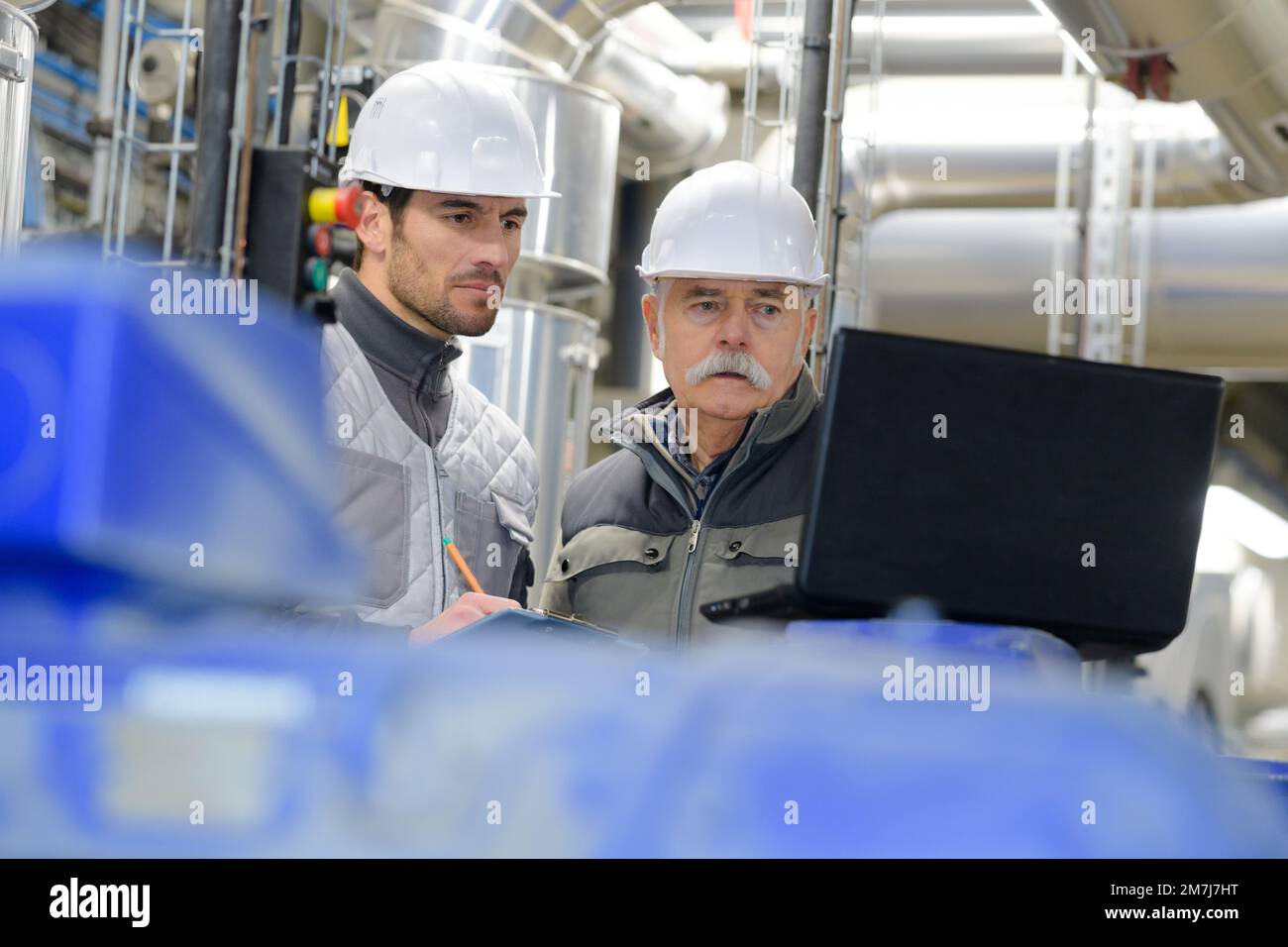 Professional senior engineer talking young hi-res stock photography and ...