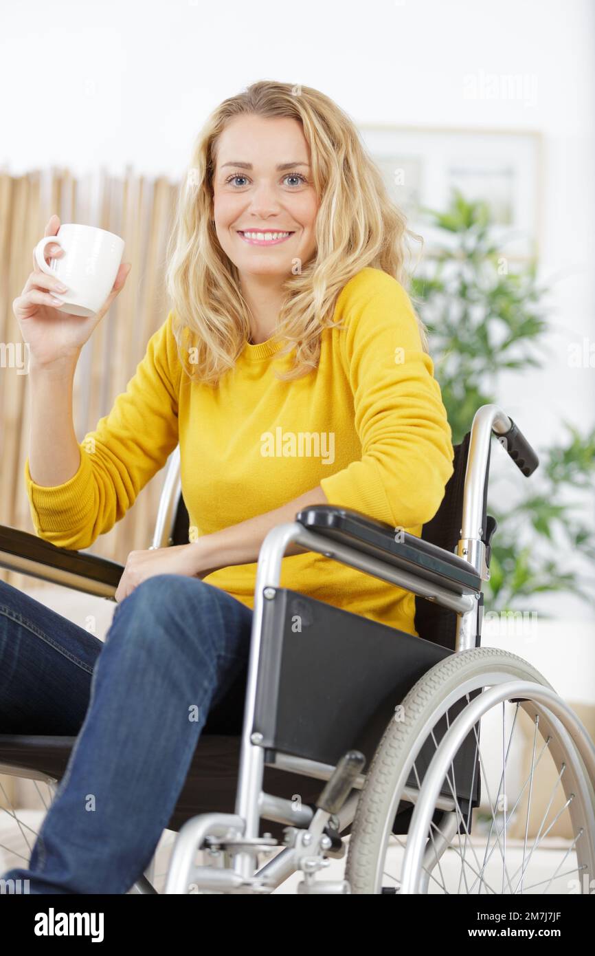 Disabled woman in wheelchair holding hi-res stock photography and ...
