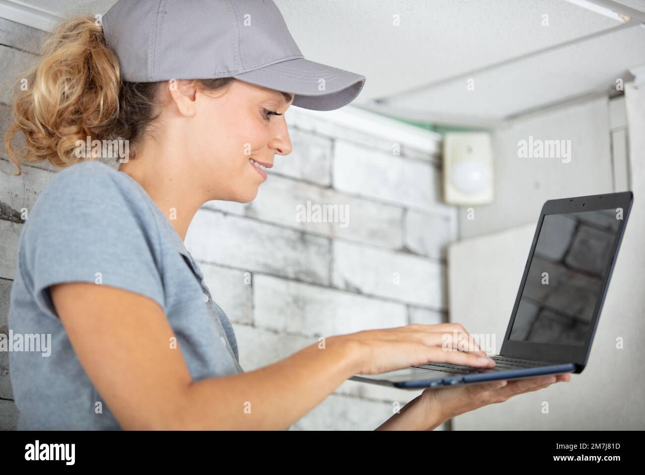 female young woman working on a laptop computer Stock Photo