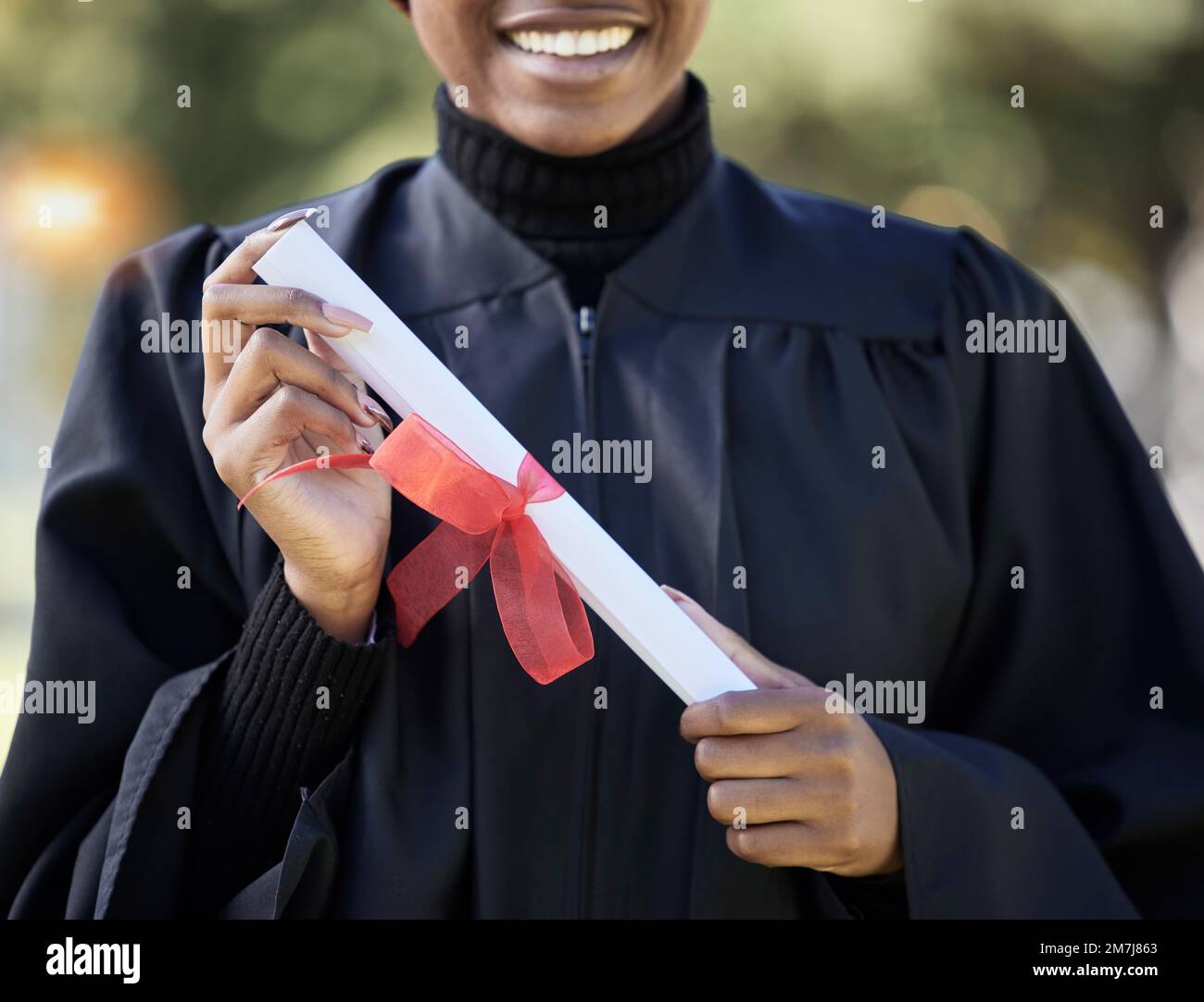 University graduation, diploma and hands of black woman with award for studying achievement. Closeup graduate student with paper certificate of Stock Photo