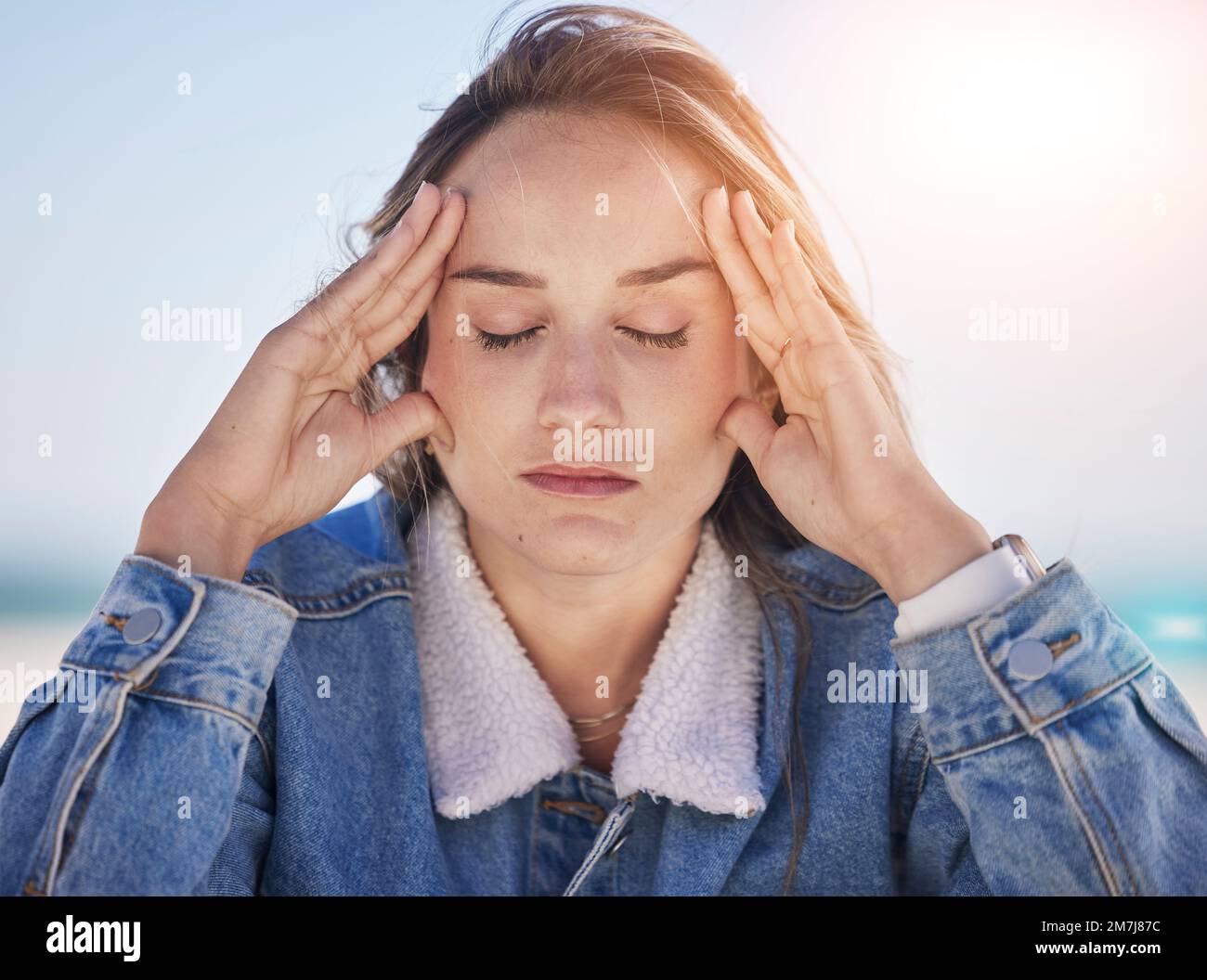 Thinking woman, stress face or anxiety by beach, ocean environment or sea nature in healthcare wellness meditation. Mental health, mind burnout or Stock Photo