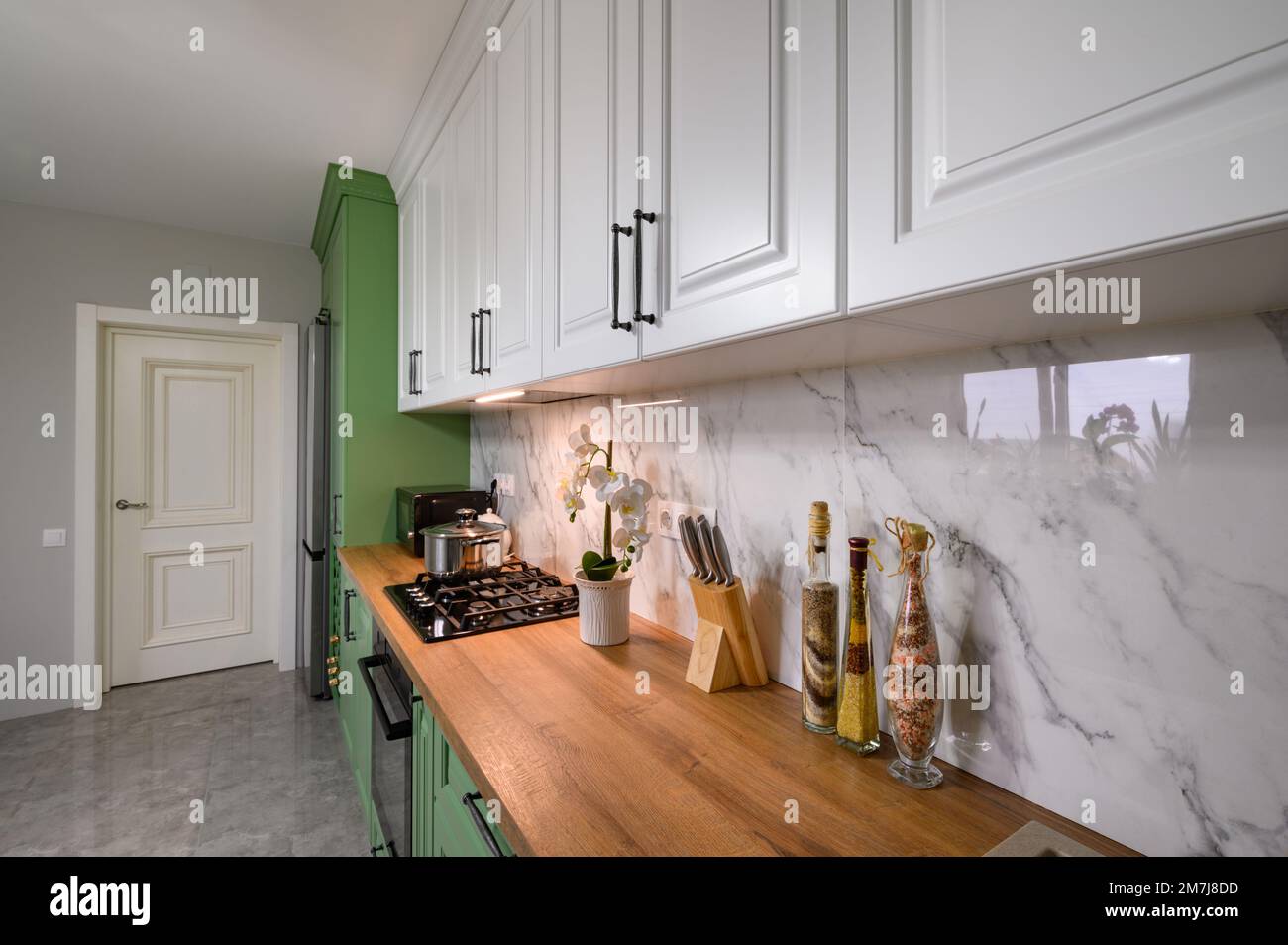 Green and white colored modern kitchen detail Stock Photo