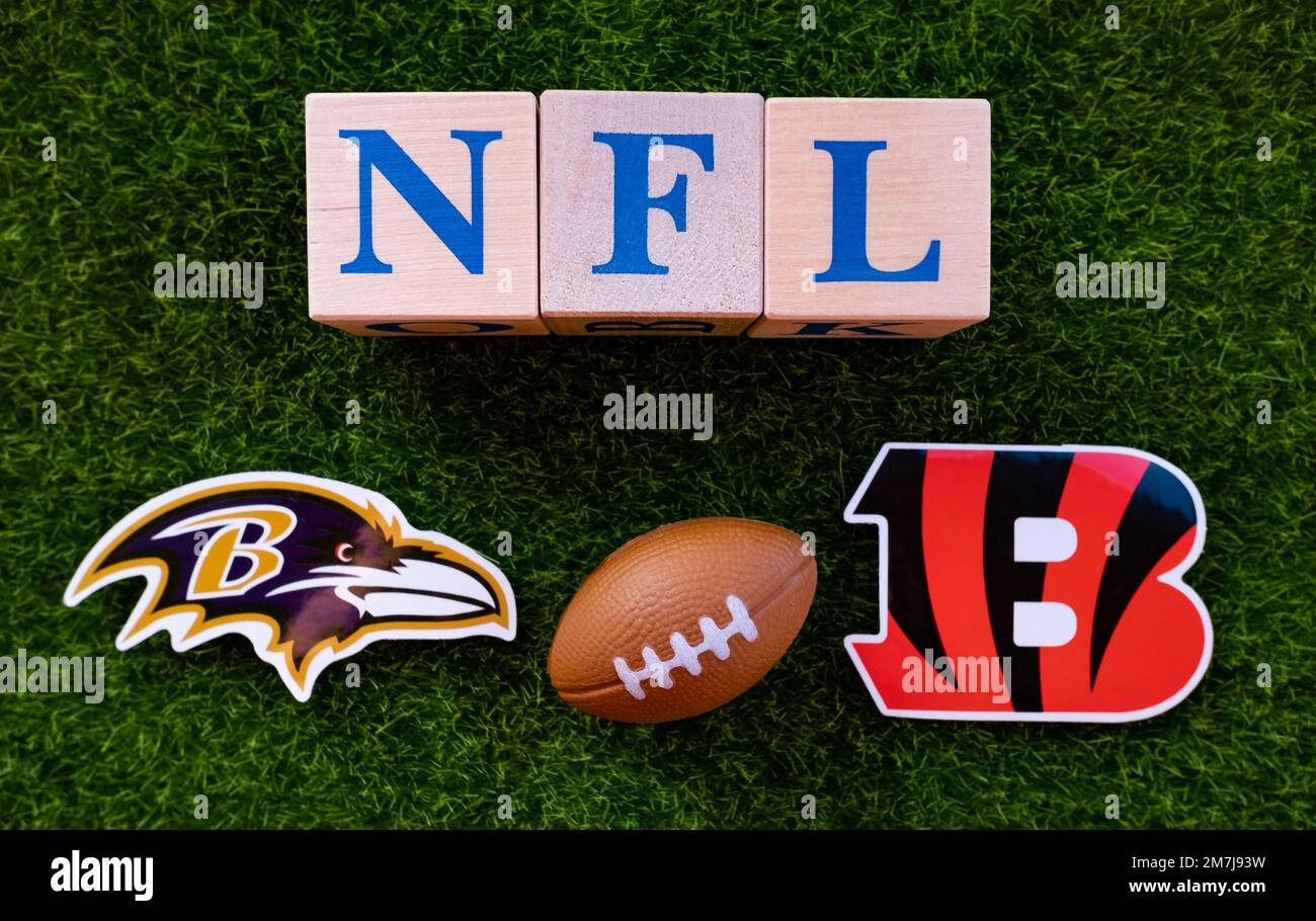 Baltimore Ravens vs. Cincinnati Bengals. NFL match poster. Two american  football players silhouette facing each other on the field. Clubs logo in  background. Rivalry concept photo. Stock Photo