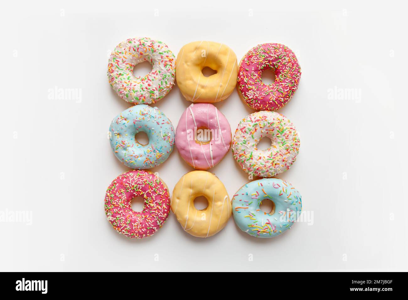 Colorful delicious donuts isolated on white background Stock Photo - Alamy