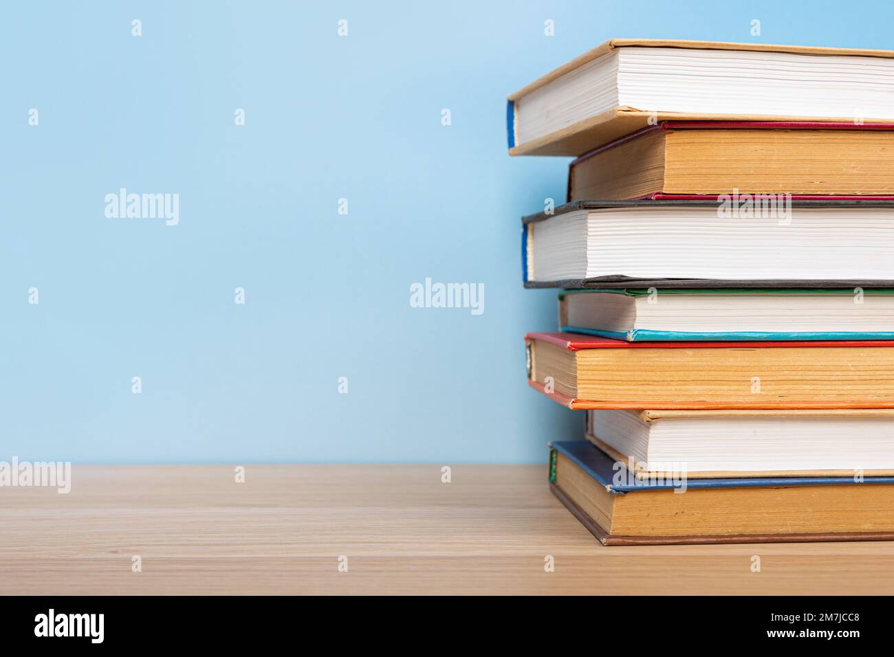 Composition with vintage old hardback books, diary on wooden table and ...