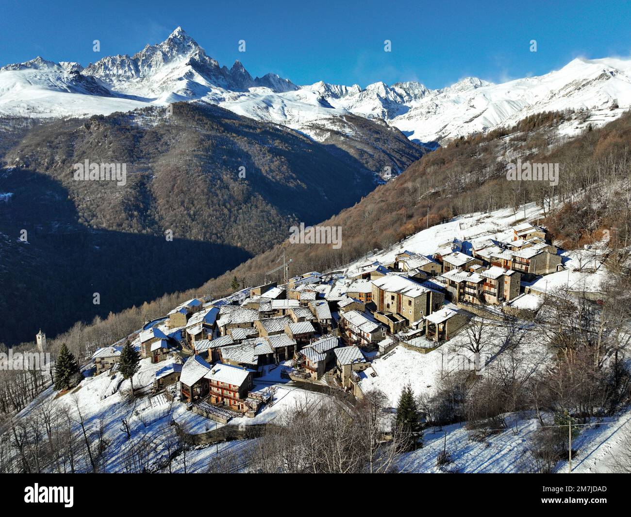 Winter view from above of Ostana, an Occitan village below Monviso. It is located in the Po Valley and is included in the list of the most beautiful v Stock Photo