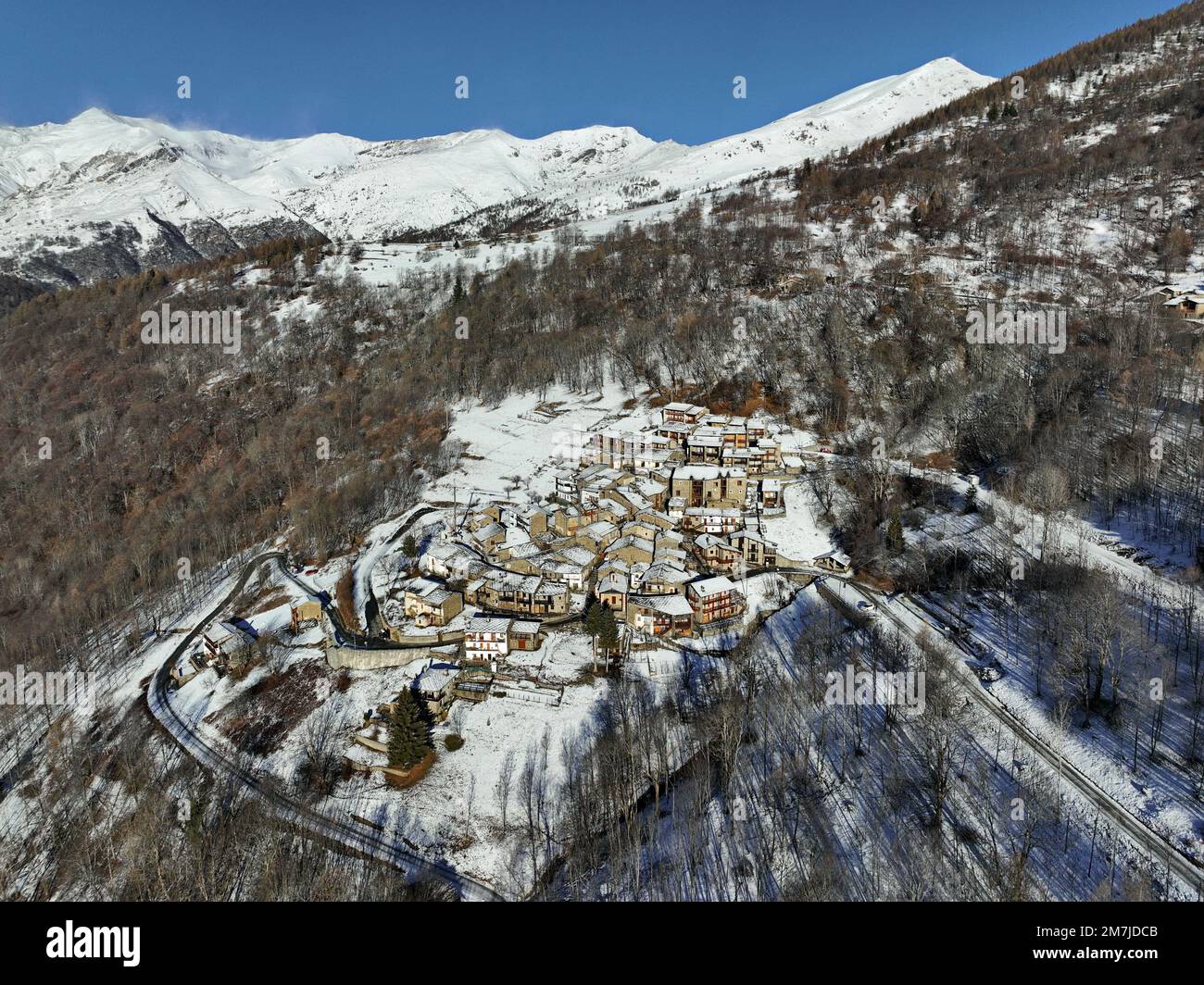 Winter view from above of Ostana, an Occitan village below Monviso. It is located in the Po Valley and is included in the list of the most beautiful v Stock Photo