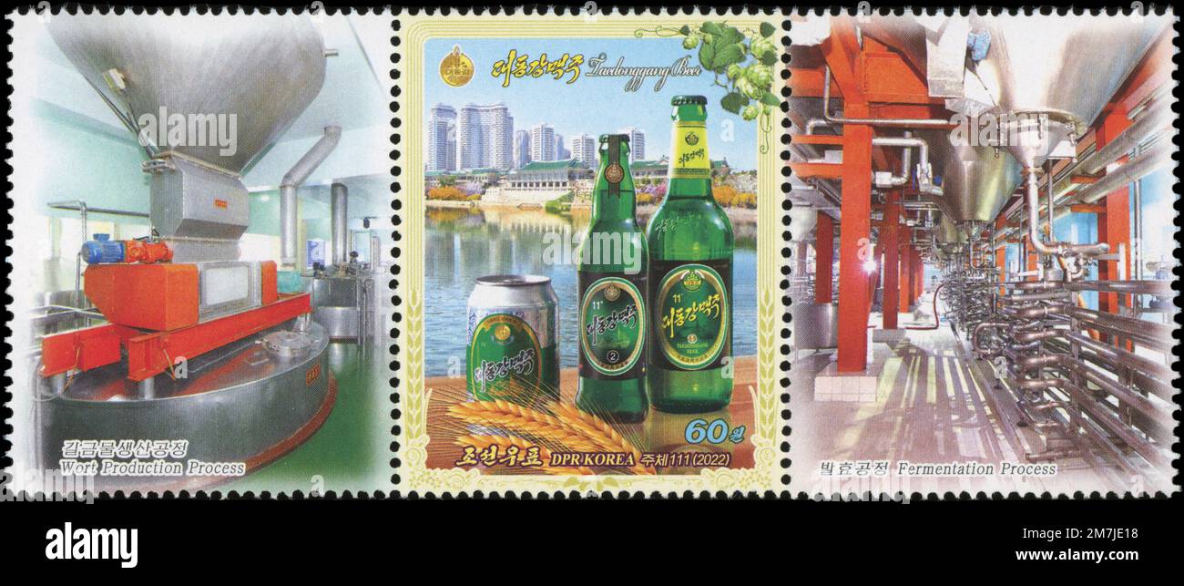 2022 North Korea stamp, Taedonggang Beer can and bottles. Stock Photo