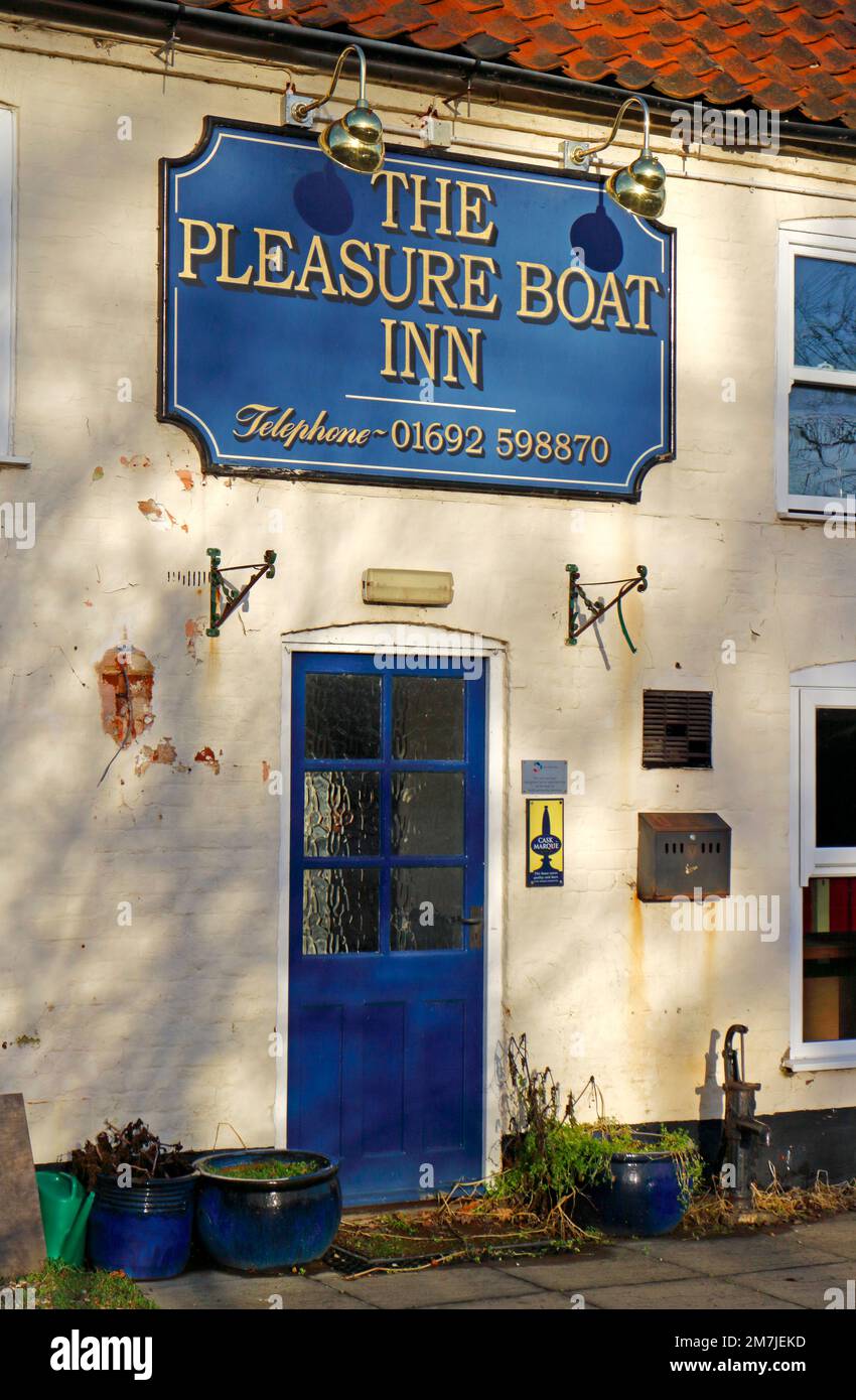 A view of the entrance door and sign to the temporarily closed Pleasure Boat Inn on the Norfolk Broads at Hickling, Norfolk, England, United Kingdom. Stock Photo