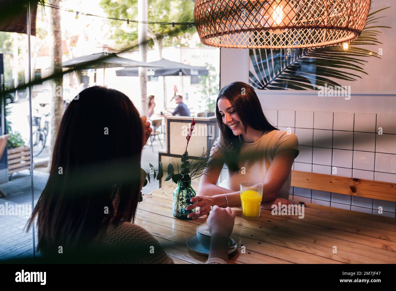 two young women on a date in a coffee shop Stock Photo - Alamy