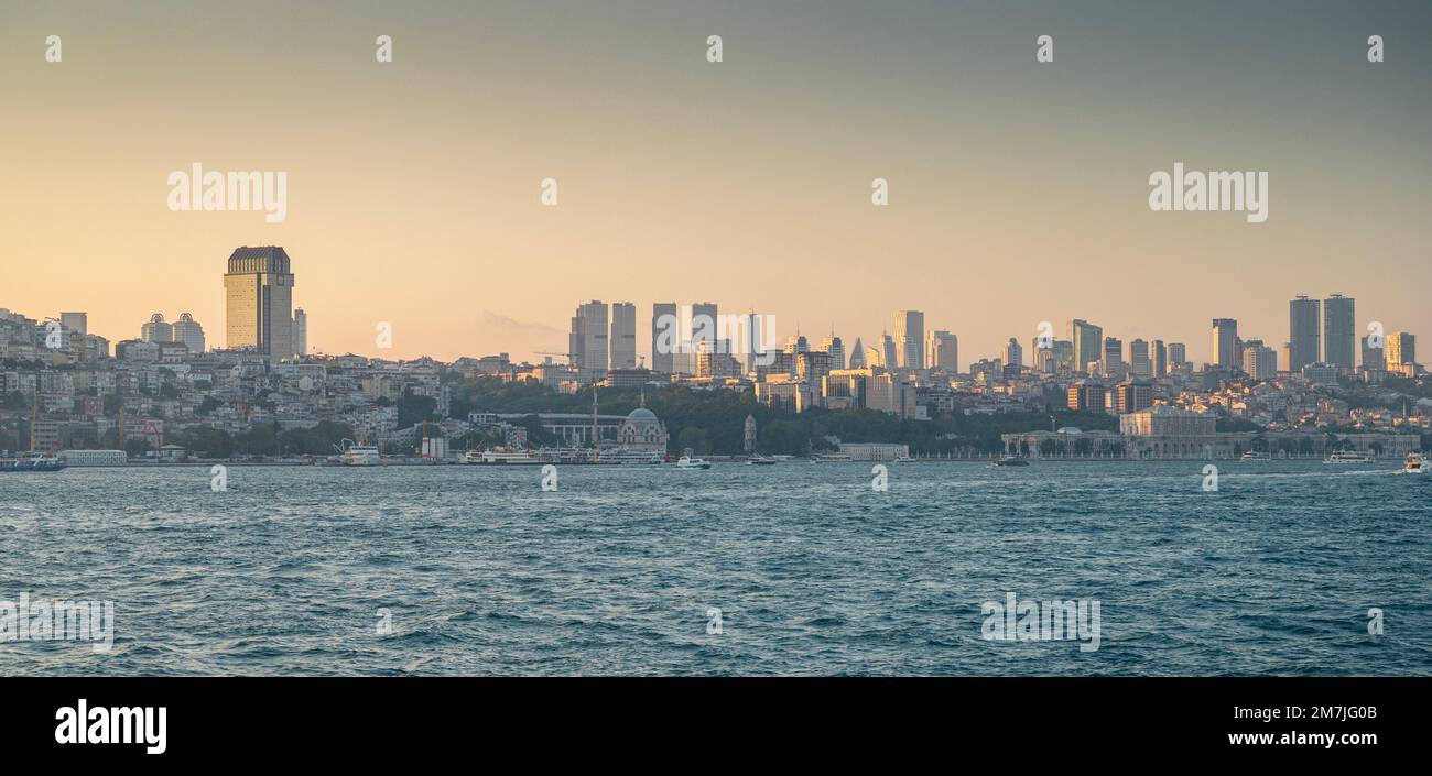 View from the sea to Istanbul at sunset. The coastline with old and new houses in the vicinity of the city. Summer panoramic  landscape. Turkey. Stock Photo